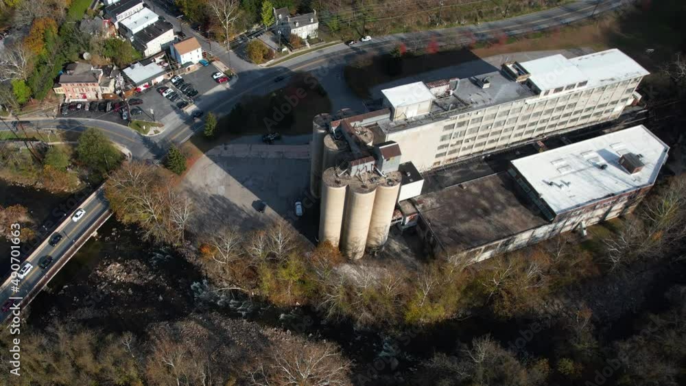Aerial View of Abandoned Flour Grain Mill in Ellicott City, Maryland USA, Historic Building and Autumn Season Foliage on Sunny Day Aerial View of Abandoned Flour Grain Mill in Ellicott City, Maryland USA, Historic Building and Autumn Season Foliage on Sunny Day