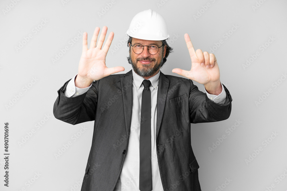 Young architect man with helmet over isolated background counting seven with fingers Young architect man with helmet over isolated background counting seven with fingers