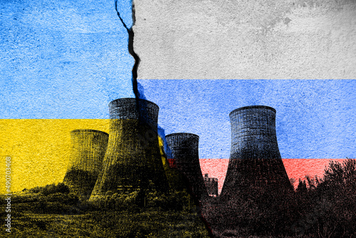 Принти на полотні Cracked concrete wall with Ukraine and Russia flags, nuclear power plant overlay
