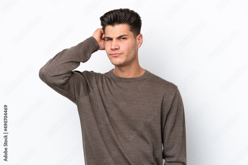 Young handsome caucasian man isolated on white bakcground having doubts Young handsome caucasian man isolated on white bakcground having doubts
