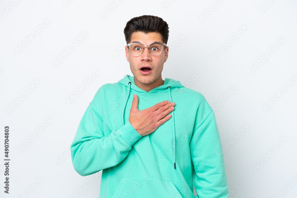 Young handsome caucasian man isolated on white bakcground surprised and shocked while looking right Young handsome caucasian man isolated on white bakcground surprised and shocked while looking right