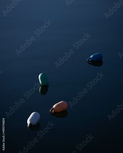 Colored buoys on the water