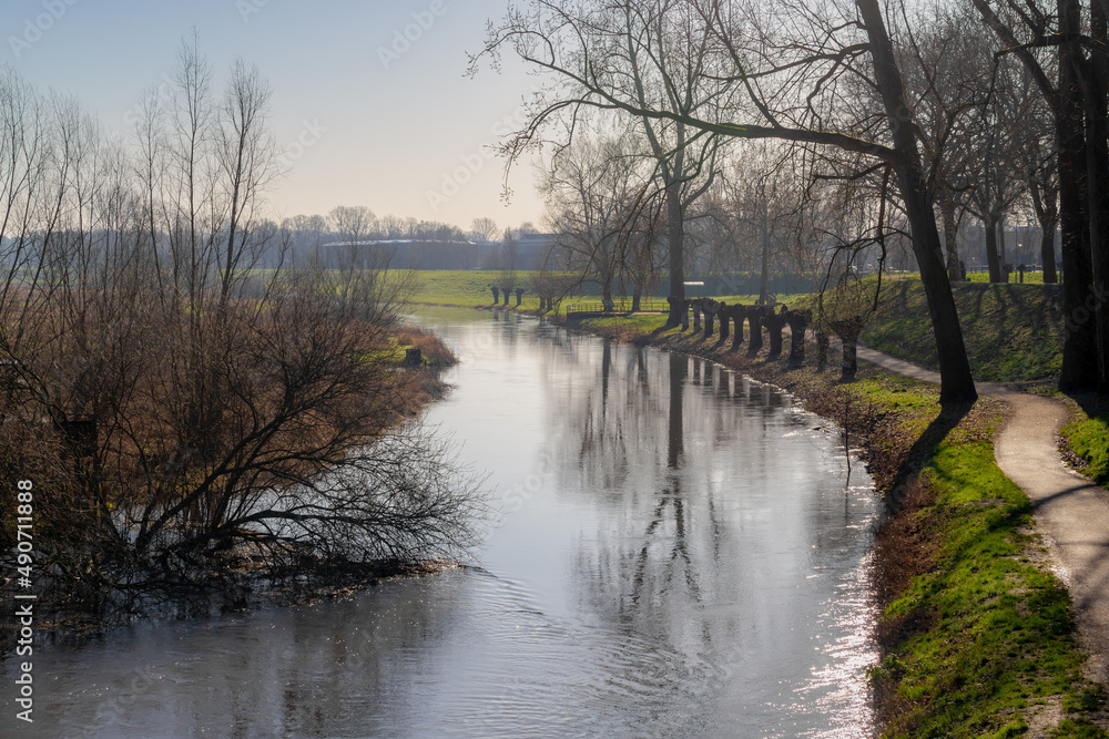 Gravel walkway along Niers river with sunlight, The river is in Germany and Holland a right tributary of the river Maas, Gennep is a municipality and a city in upper southeastern Netherlands, Nijmegen Gravel walkway along Niers river with sunlight, The river is in Germany and Holland a right tributary of the river Maas, Gennep is a municipality and a city in upper southeastern Netherlands, Nijmegen