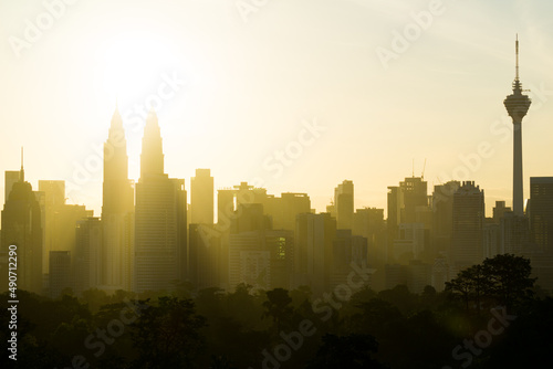 Photography Majestic sunrise over downtown Kuala Lumpur with Petronas Twin Towers and KL Tower still among the significant landmarks and icon for Malaysia