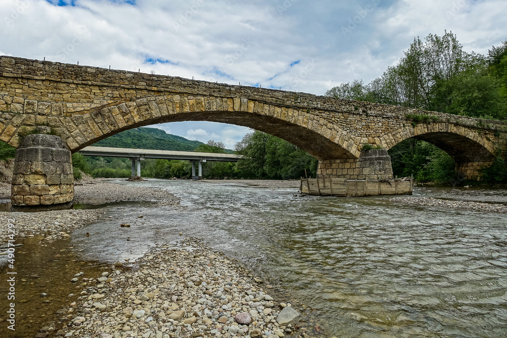 Fototapeta premium Dakhovsky picturesque stone bridge over the Dakh River Adygea. Russia. 2021.