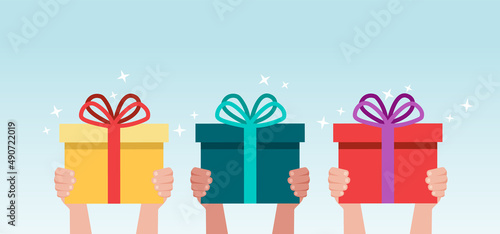 Hand giving gift box cartoon vector illustration. Hand holding surprise box concept.