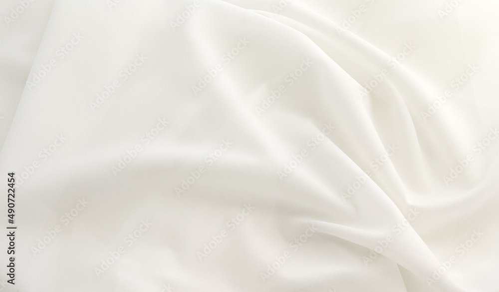 Obraz premium Smooth elegant white silk or elegant satin texture can be used as background, elegant wedding background design.