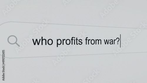 Who profits from war? - Internet browser search bar question typing war related question with camera movement. photo