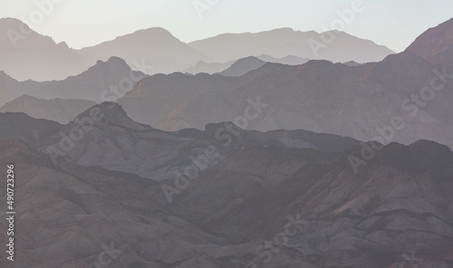 Dramatic layered mountains of Sinai in the evening. View from Dahab. South Sinai, Egypt