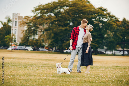 happy couple with dog in Chicago park
