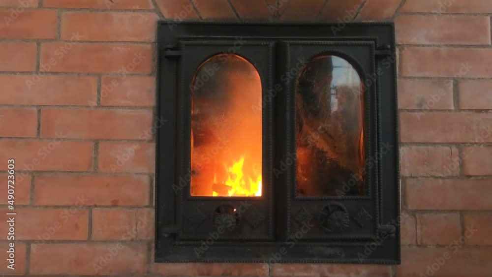 the stove with an open flame is burning in the house the stove with an open flame is burning in the house