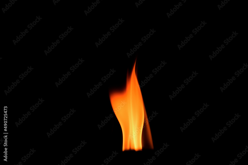 Close up burning flames on black background for graphic design or wallpaper Close up burning flames on black background for graphic design or wallpaper
