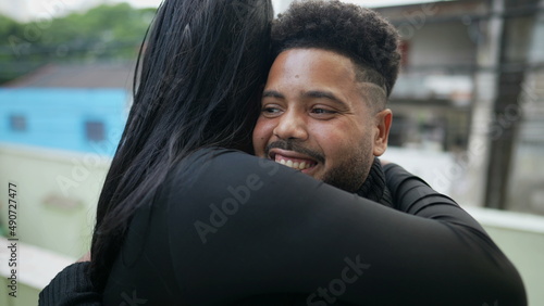 Two friends hugging each other casual male and female friendship photo