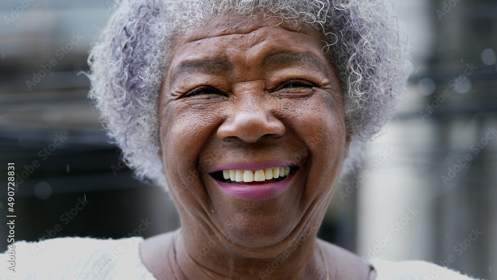 A joyful older black woman authentic smile real happy expression A joyful older black woman authentic smile real happy expression