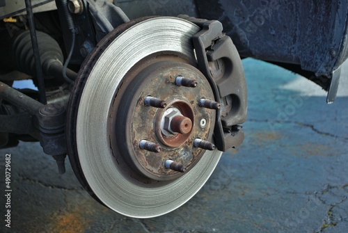 ruined disc brake rotor seen on a vehicle