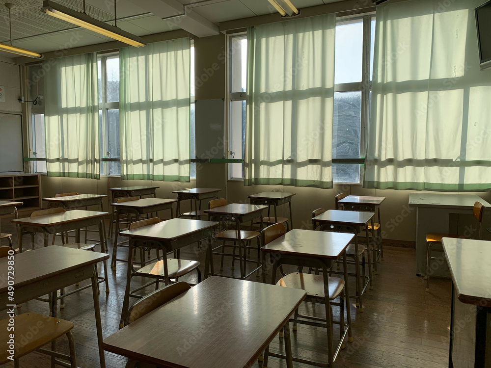 Japanese public school classroom with wooden chairs and desks.  - obrazy, fototapety, plakaty 