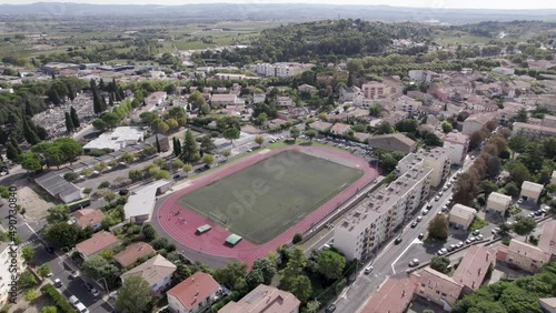 Jean Pinet Football soccer stadium in the town of Clermont-l'Hérault in southern France, Aerial orbit shot photo