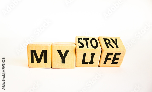 Story of my life symbol. Turned wooden cubes and changed concept words My story to My life. Beautiful white table white background. Business story of my life concept. Copy space.