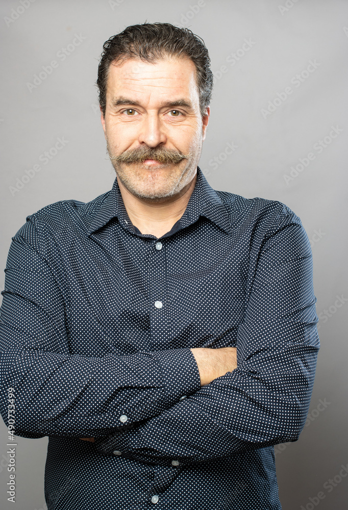 Obraz premium Silly moustache man studio portrait series on grey background
