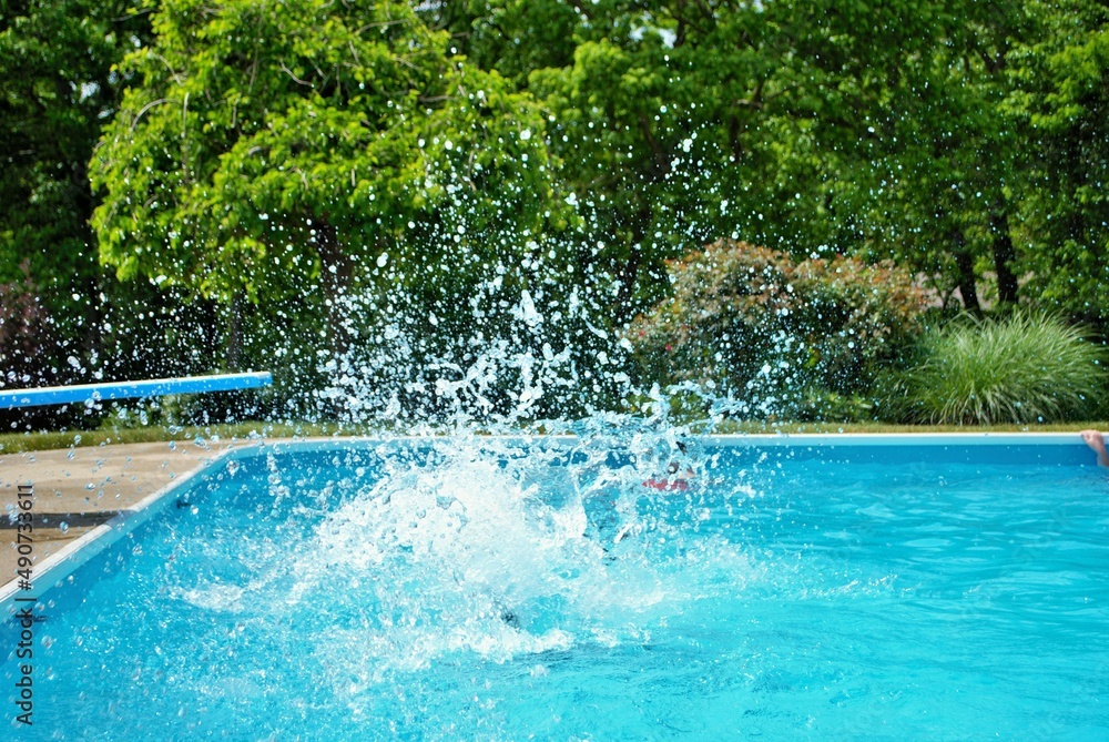 Big splash after someone jumped off the diving board Big splash after someone jumped off the diving board