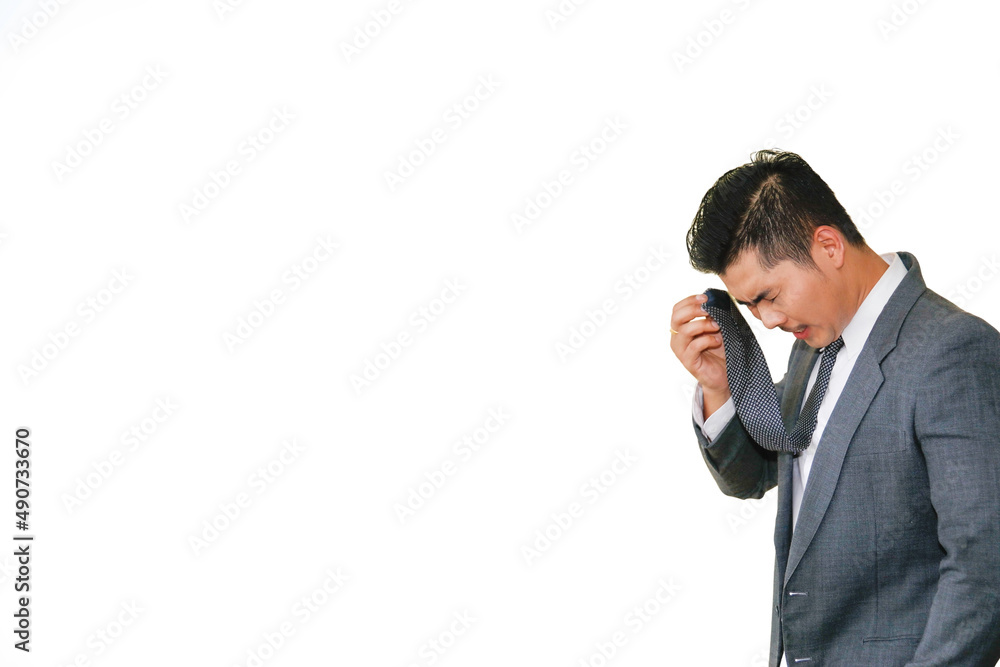 Handsome man showed emotion and tiredness and used a necktie to wipe the sweat on the face due to the heat of the weather : white background. Handsome man showed emotion and tiredness and used a necktie to wipe the sweat on the face due to the heat of the weather : white background.
