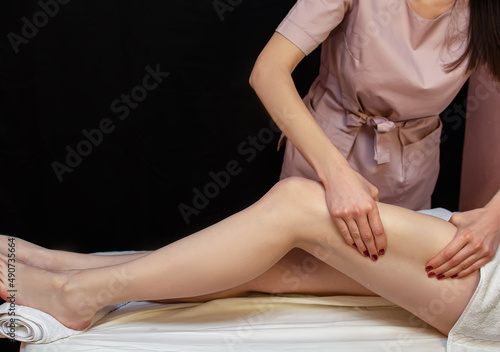 Exfoliation with a natural bristle brush. Dry brush massage. Preparing the skin for epilation. Strawberry legs, keratosis. Home skin and body care. SPA. Hairy legs. Beautiful slim female legs.