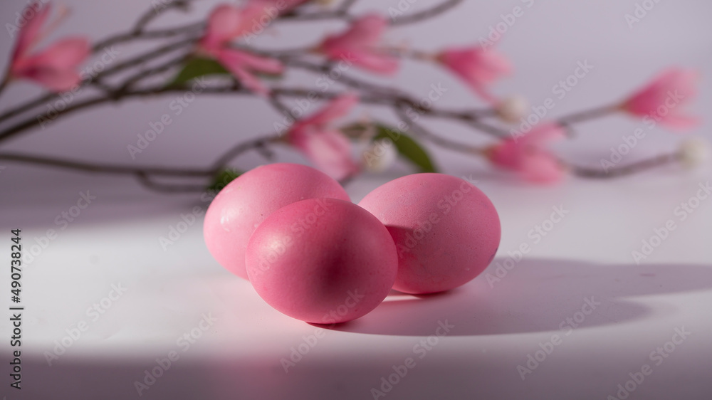 Easter eggs in a beautiful and simple composition with decorations Easter eggs in a beautiful and simple composition with decorations