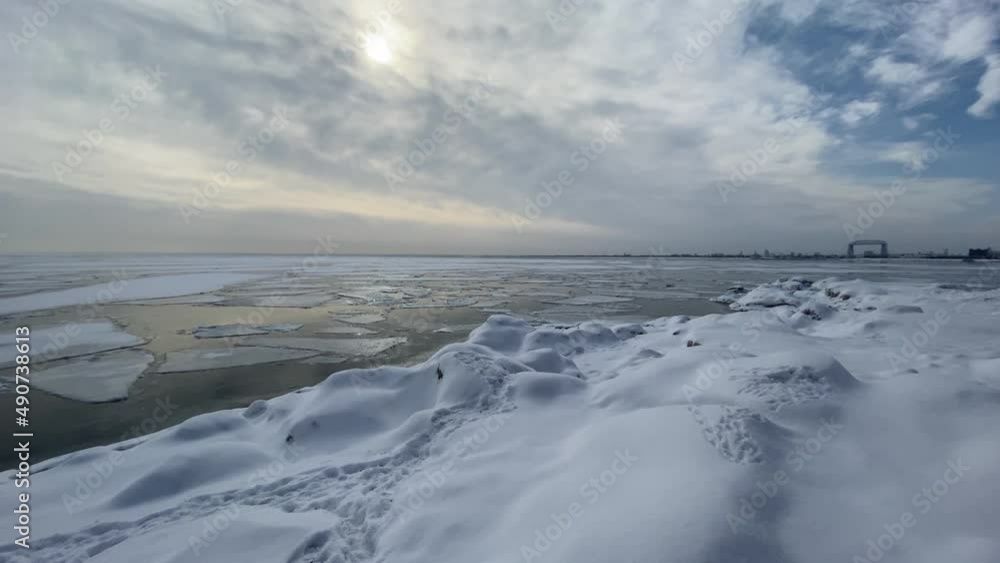 Winter landscape lake superior frozen, Canal park bridge Duluth on the background Winter landscape lake superior frozen, Canal park bridge Duluth on the background