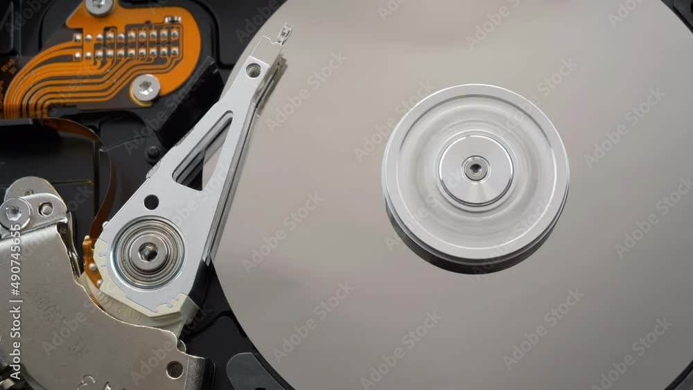 Hard Disk Drive. Disassembled HDD start and stop, view from top Hard Disk Drive. Disassembled HDD start and stop, view from top