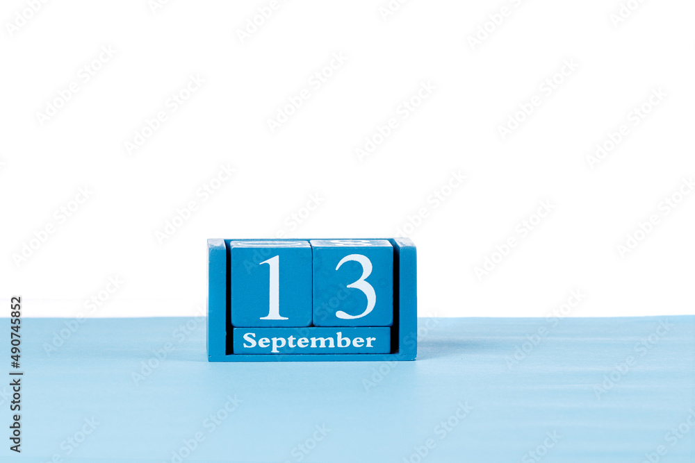 Wooden calendar September 13 on a white background Wooden calendar September 13 on a white background