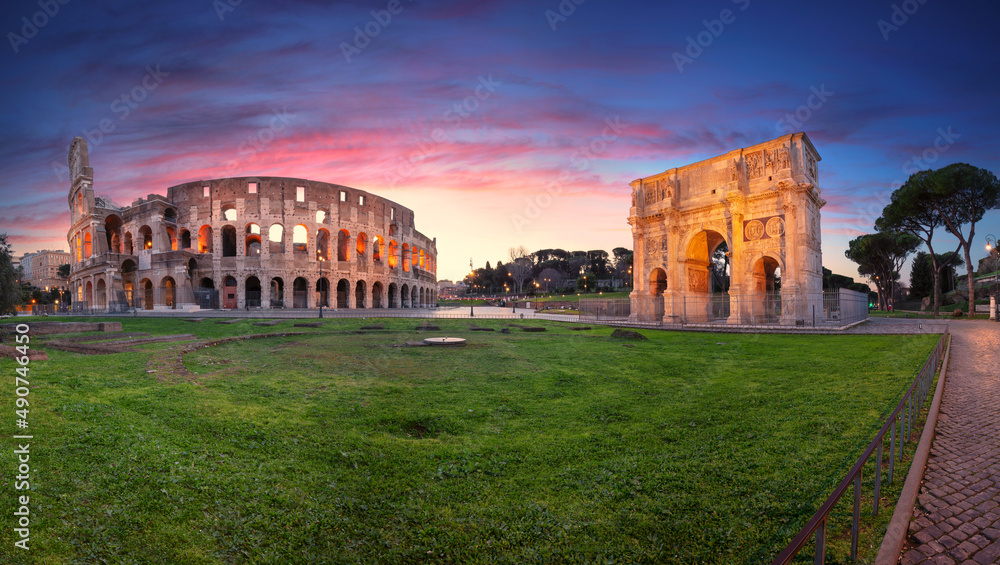 Colosseum, Rome, Italy. Panoramic image of iconic Colosseum and Arch of Constantine in Rome, Italy at beautiful sunrise.