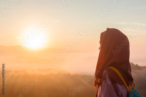 Watching the sunrise from the tourist destination of Mount Ireng, the golden sunrise is very beautiful making the silhouettes of the visitors
