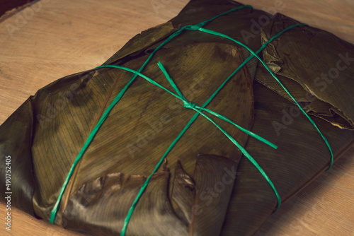 Colombian tamale recipe with steamed banana leaves photo