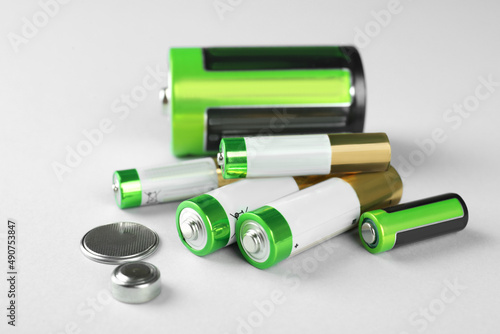 Canvastavla Different types of batteries on light background