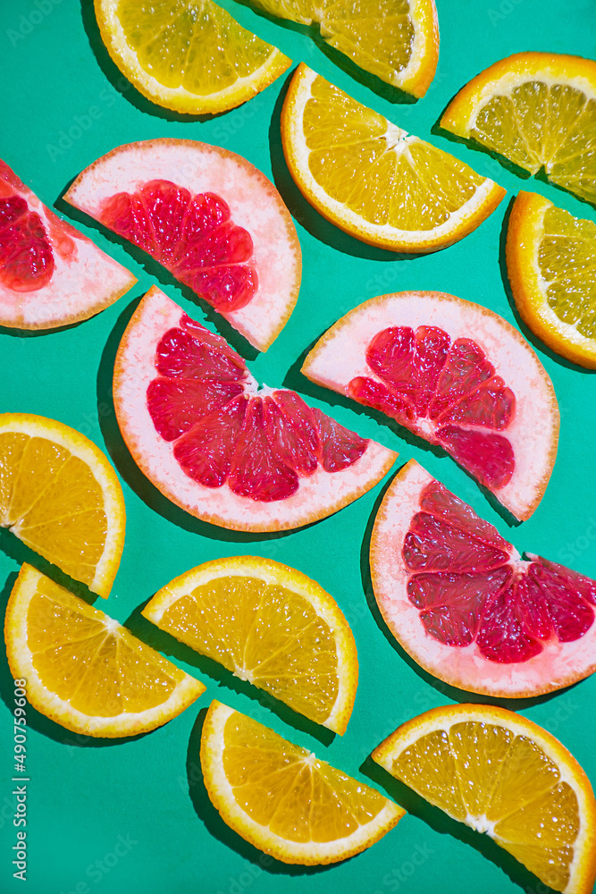 fruit citrus slices of grapefruit and orange on the turquoise bright background fruit citrus slices of grapefruit and orange on the turquoise bright background