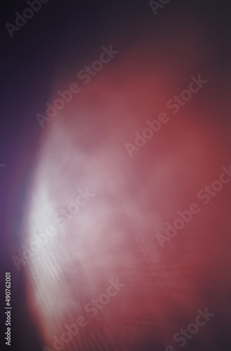 blue and red background of dark wall illuminated by electric light