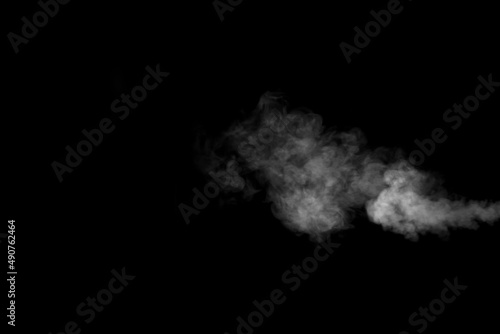 A swirling horizontal vapor isolated on a black background for overlaying on your photos. Fragment of horizontal steam