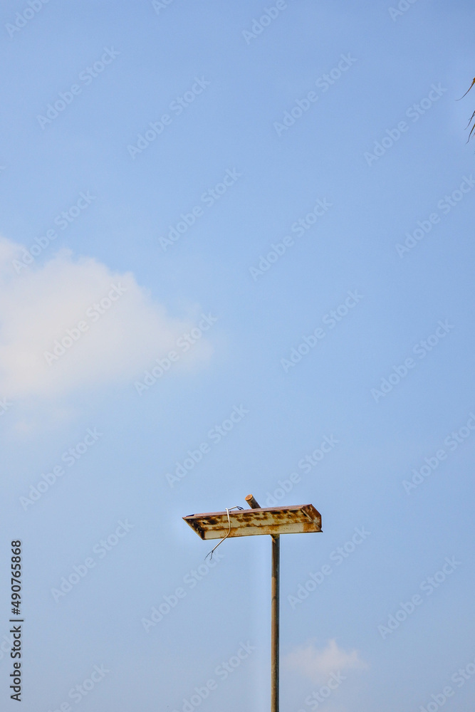 rusty street lamps and bright blue sky rusty street lamps and bright blue sky