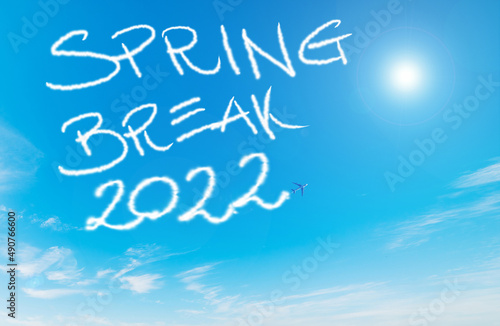 Spring break 2022 written by contrails in the blue sky photo