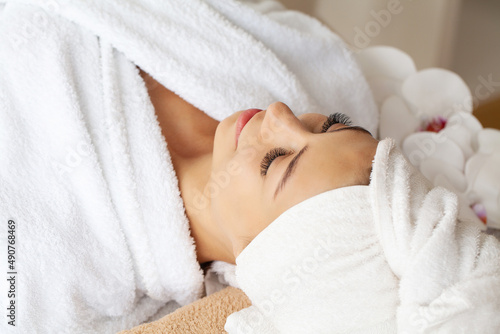 Beautiful woman getting face massage in beauty spa