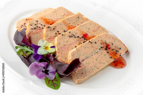 Salmon fillet pate with fillet pieces in sauce. Banquet festive dishes. Gourmet restaurant menu. White background.