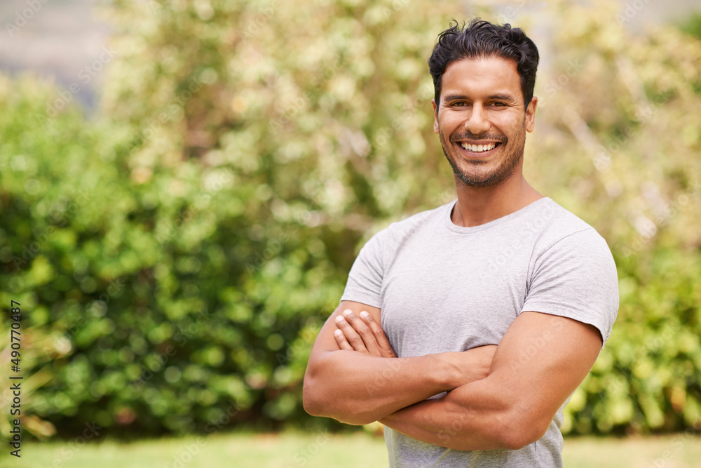 Hes got such a charming smile. Portrait of a handsome man standing outside. Hes got such a charming smile. Portrait of a handsome man standing outside.