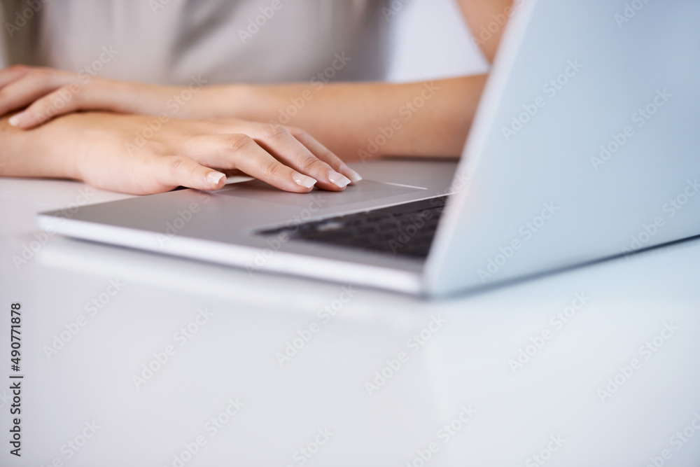 Technology aids efficiency. Croppsed shot of a young businesswoman working in an office. Technology aids efficiency. Croppsed shot of a young businesswoman working in an office.