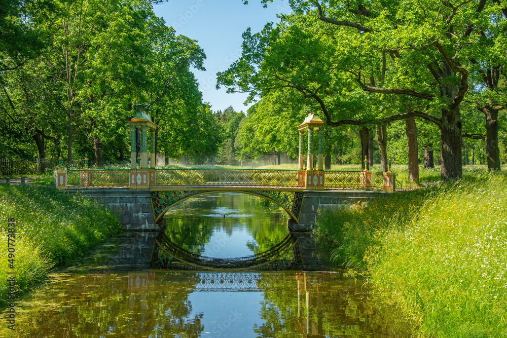 Chinese bridge over Krestovy Canal in Alexander Park on a sunny summer day in Tsarskoye Selo (Pushkin), Russia