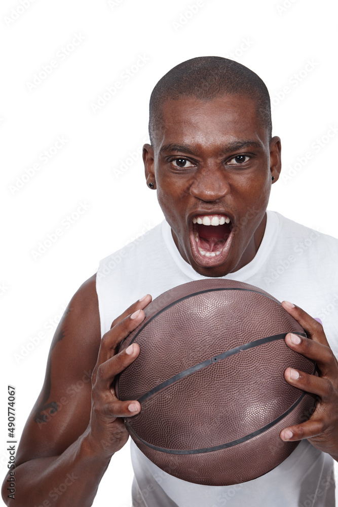 Its game on. Studio shot of a determined young basketball player shouting while holding a basketball. Its game on. Studio shot of a determined young basketball player shouting while holding a basketball.