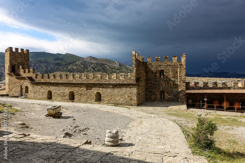 Picturesque view with a stormy sky of the ancient Genoese fortress, Sudak, Crimea May 2021.