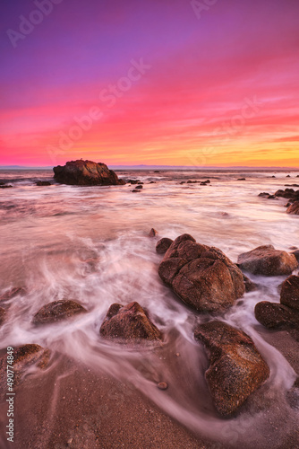Fototapeta Naklejka Na Ścianę i Meble -  Sunrise on the rocky shore of Pacific Grove overlooking Monterey Bay.