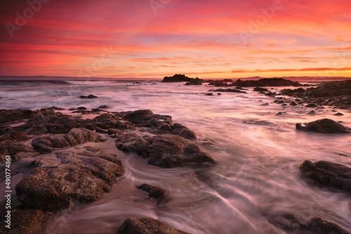 Sunrise on the rocky shore of Pacific Grove overlooking Monterey Bay.