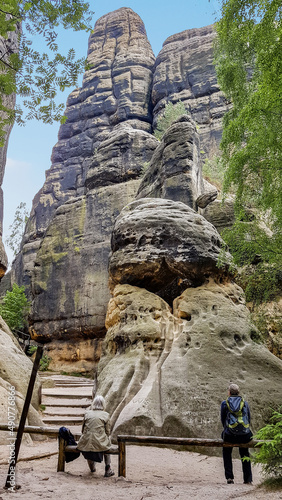 Two people look at the Great Schrammtor rocks, Saxony, Germany photo