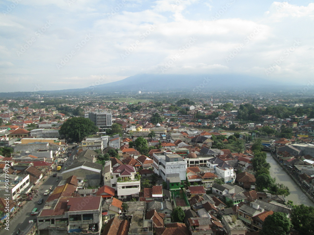 Bogor, Indonesia - April 20, 2018: View of settlements and buildings from the roof of BTM Mall at noon